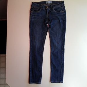 Dark denim skinny jeans.